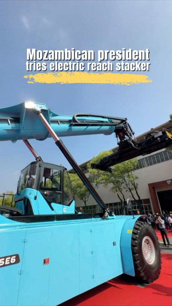 Mozambican president tries electric reach stacker in China